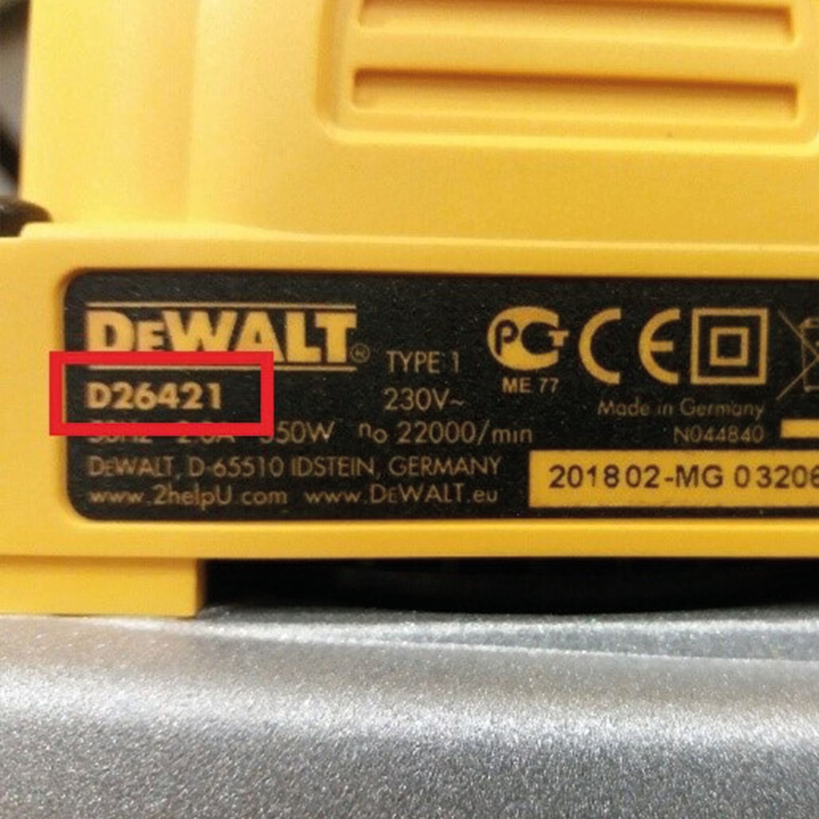 Close-up of a DEWALT power tool label displaying model number D26421 highlighted in red, along with technical specifications and certification markings.